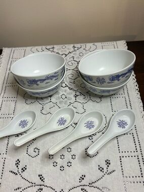 Chinese-style blue and white rice bowls featuring a dragon motif with spoons